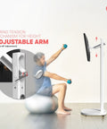 Mobile Floor Stand For Monitors And TVs Up To 35 Inches Weighing 22 Lbs With Anti Knockdown Base And Adjustable Height next to man exercising