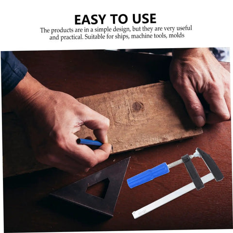 Four Pack Woodworking Clamps Durable Spring Fixing Tools With Beefy Grip for DIY projects, shown securing wooden board.