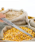 Pro Grade Portable Stainless Steel Grain Sampler With Rubber Grip in use sampling corn from burlap sack, precise testing tool.