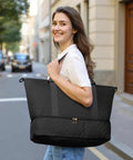 Woman carrying Spacious Travel Duffel Bag For Women With Shoe Compartment And Carry On Weekender Tote for gym and weekend trips