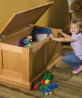 Child opening a wooden chest with lid stay torsion hinges for cabinets, soft close, rustic bronze finish, heavy duty cast zinc hardware, pair of 2, 40 lb lid support, smooth opening and hold open at 90 degrees.