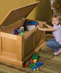 Child with open chest showing Heavy Duty Lid Stay Torsion Hinge For Chests And Storage Trunks 60 Inch-Pound Capacity Rustic Bronze Finish