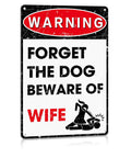 Hella Durable Metal Wall Art Sign For The Man Cave Featuring Funny Forget The Dog Beware Of Wife Quote In Rust Proof Aluminum Garage Decor That Is Legit Tough And Totally Bro Approved 12 By 8 Inch. Displayed on a white background.