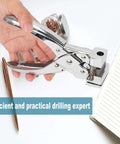 Hand using Heavy Duty T Slot Hole Punch Handheld Cutter for tags and ID cards, showing metal body, next to a notebook and pen