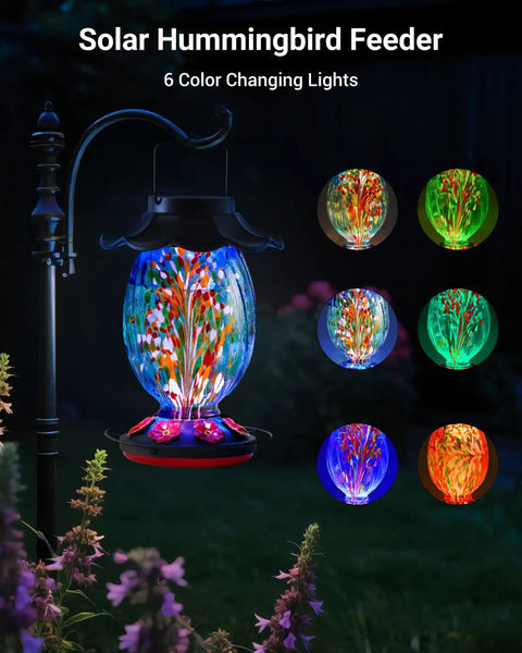 Solar Powered Hummingbird Feeder With 49 Fl Oz Capacity Hand Blown Blue Glass Color Changing Night Glow installed outdoors
