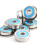 Thinking Process: stainless steel deep groove ball bearings with blue seals, shown stacked for motors and machinery