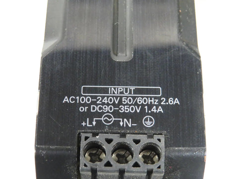 Close-up of DIN Rail Power Supply 120W 24V DC 5A Enclosed Switch Mode With Adjustable Output 100 240VAC Input Industrial Grade Used But Working Compact Aluminum Enclosure Beefy Build input terminals and voltage markings.