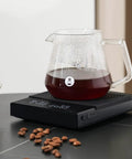 Coffee Scale Basic 2.0 with water flow rate, timer, and easy unit switcher, pro-grade digital kitchen scale in black with glass carafe