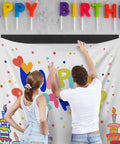 Two people using Heavy Duty Hook And Loop Tape Adhesive Roll 4.4 Inch By 16.5 Foot Black Velcro Strips For No Punch Wall Mount to hang a birthday banner.
