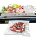 Straight Up Game Changing Compact Vacuum Sealer Machine With One Touch Automatic Sealing with vacuum-sealed steak and vegetables.