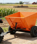Towable Sand And Gravel Spreader For ATV UTV, 71 Gallon 270 L Capacity, 882 Lb Load, attached to ATV on dirt road