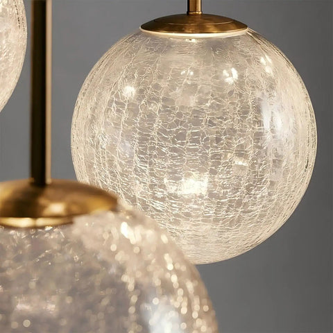 Close-up of Top Shelf Modern Crackle Glass Sphere Pendant Cluster Integrated Led Brass Finish, showcasing intricate glass texture.