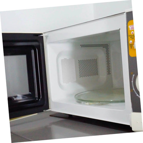 Open microwave showing installed 30 Pcs Oven Mica Plates and Microwave Mica Sheets heat insulation covers on waveguide panel.