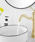 360 Degree Swivel Vessel Sink Faucet With One Hole Install, Brushed Gold Farmhouse Vanity Faucet next to basin
