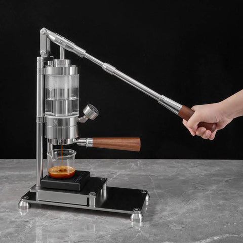 Top Shelf Manual Lever Espresso Maker Built From Heavy Duty 304 Stainless Steel with wood grip in use for homemade espresso.