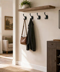 Solid Build Vintage Black Wall Hooks Heavy Duty Coat And Towel Rack Four Pack displayed with a brown bag and jacket hanging.