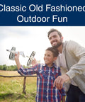 Father and son playing with Balsa Wood Airplane Glider Kit Pack Of 6 For Kids, enjoying outdoor fun with DIY model planes.