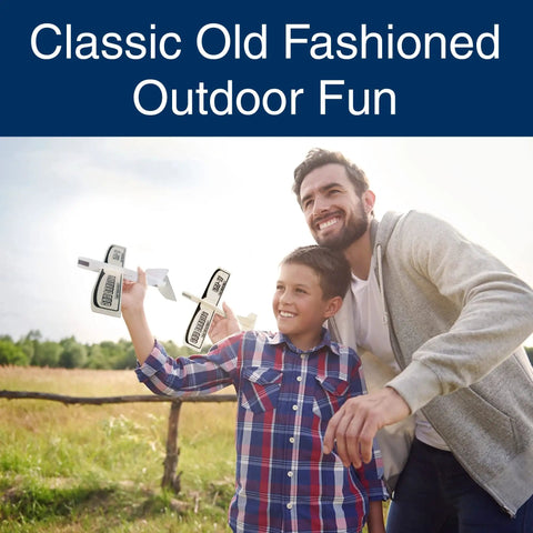 Father and son playing with Balsa Wood Airplane Glider Kit Pack Of 6 For Kids, enjoying outdoor fun with DIY model planes.