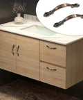 Bathroom cabinet with mounted 10 Pack Cabinet Drawer Pulls With Two And A Half Inch Hole Centers Solid Copper Red Handles installed.