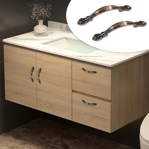 Bathroom cabinet with mounted 10 Pack Cabinet Drawer Pulls With Two And A Half Inch Hole Centers Solid Copper Red Handles installed.
