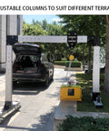 Rock Solid Portable Gantry Crane With Four Thousand Four Hundred Pound Lift Capacity And Adjustable Span And Height For Tight Workshops That Makes Hauling Heavy Machinery A Total Breeze With No Sweat, outdoors with adjustable columns.