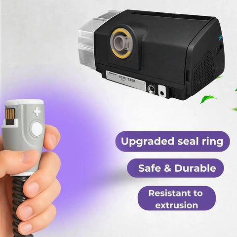 Person holding connector of Insulated Warming Climate Line CPAP Hose For AirSense 10 And AirCurve 10 near a CPAP machine.