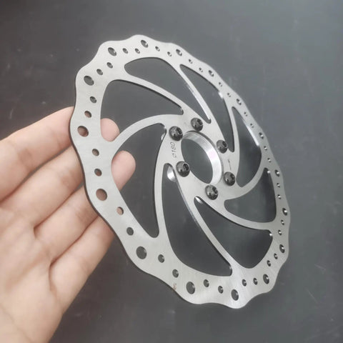 180mm Bicycle Disc Brake Rotor With Flange Adapter For Threaded Hubs Stainless Steel 2mm Thick Silver Finish in hand
