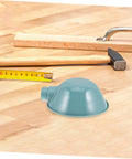 Heavy-Duty Round Machine Tool Lampshade With Protective Cover For Industrial Workbench Lighting sitting on a wooden work surface.