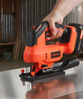 Badass 20V Brushless Cordless Jigsaw, Knockout 3500 SPM Variable Speed With Standard Battery Hookup, Built In Led Lamp, Four Orbital Settings, Six Fresh Blades For Pain Free Wood And Metal Jobs Daily in use with metal surface.