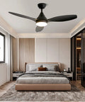52 Inch Black Ceiling Fan With Remote And Light, Dope Modern Three Blade Fixture For Bedroom Living Room Dining Room And Patio, Quiet Motor Under Thirty Five Decibels, Includes Remote Switch And Optional Six Or Ten Inch Downrod in a bedroom setting
