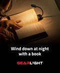 Person reading book in bed with Rechargeable Clip On Book Light For Reading In Bed Hands Free With 3 Light Modes