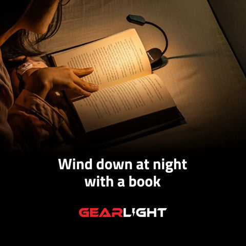 Person reading book in bed with Rechargeable Clip On Book Light For Reading In Bed Hands Free With 3 Light Modes