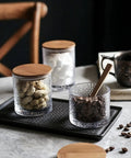 Top Shelf Airtight Glass Storage Jars 320 Milliliters With Durable Sealed Lids for coffee beans and snacks on a kitchen countertop.