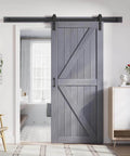 Gray Wood Barn Door Slab 36 Inch By 84 Inch With 6.6 Ft Barn Door Hardware Track Kit Included Double Sided Surfaces Easy Assembly K Frame Spruce Wood Rustic Modern Home installed in living space.