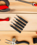 Top Tier 5 Piece Copper Soldering Iron Tips Set Including Durable Model I B K And 2.4d Nozzles made of copper with black coating on wooden surface.