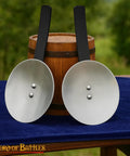 Pair of 16 Gauge Steel Rondels With Genuine Leather Straps for Elbows and Knees Armor on table for reenactment use