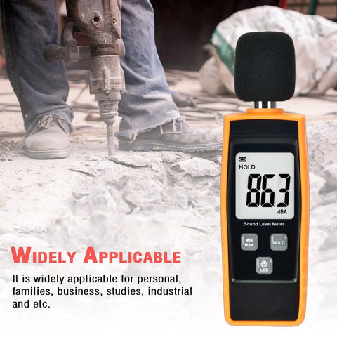 Portable Handheld Sound Level Meter For Indoor And Outdoor Noise Testing, 30 To 130 dB, Backlit LCD Display, Max Min Hold Functions, The No Nonsense Practical Little Tool For Noise Pollution Monitoring And Home Theater Setup. Orange handheld sound meter showing 86.3 dBA at a demolition site.