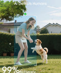 Woman playing with dog in garden, showing PIR Human Detection feature of Solar Powered 2K Outdoor Security Camera With 360 Degree Pan Tilt