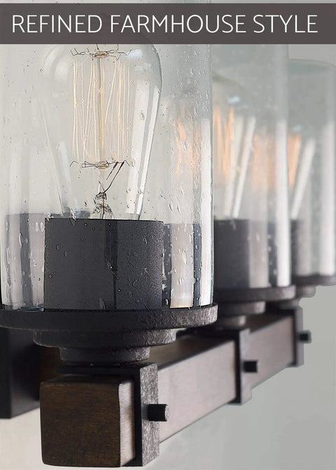 Close-up of seeded glass shades and walnut wood bar on 3-Light Farmhouse Vanity Light, 23 Inches, Black Textured Finish