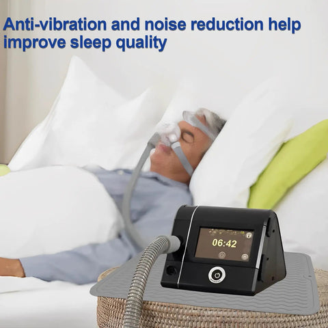 Person sleeping with CPAP machine on CPAP Silicone Protector Mat For Nightstand Waterproof Non Slip Pad Guards Against Water Spills