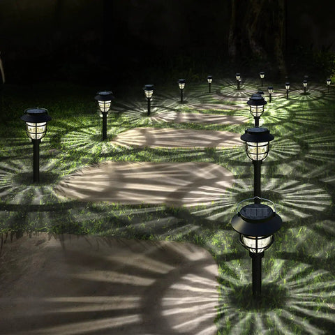Bright Solar Pathway Lights Outdoor 10 Pack With Warm White LED Auto On Off Waterproof Garden Path Lights illuminating a walkway