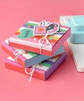 Stack of colorful shadow boxes made with Shadow Box Paper Punch Board For DIY Crafts And Card Making Creates 2 To 5 Inch Shadow Boxes.