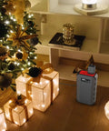 Massive 24000mAh Portable Power Bank With 110V 65W AC Outlet 88.8Wh Power Station displayed near holiday decor