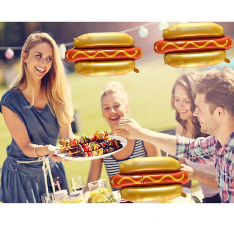 Group enjoying BBQ with Six Pack Hot Dog Balloons Set For Food Theme Parties, Summer BBQs And Picnic Decor visible in background.