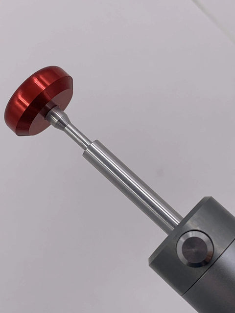 Close-up of Pro Grade Solder Sucker Desoldering Pump With Elastic Silicone Nozzle, featuring the red nozzle and metal shaft