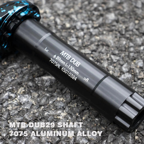 Beefy Mountain Bike Crankset 29mm DUB spindle, AL7075 aluminum, for Enduro bikes, visible on rough terrain.
