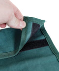 Close-up of green tool pouch fabric with velcro, part of the 2 In 1 Garden Kneeler Bench With Tools Pouch Folding Garden Stool.