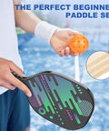 Person holding a pickleball paddle with a graphic design and an orange ball, focus on "All In One Pickleball Net Set On Wheels For Driveway Or Backyard With 22 Foot Regular Size Includes 4 Paddles 6 Balls 12 Court Markers And A Durable Carry Bag For Indoor Outdoor Play".