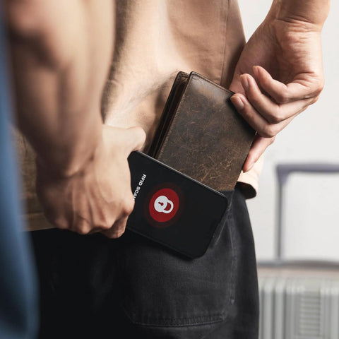 Person placing wallet with RFID Blocking Cards 4 Pack for Credit Cards and IDs, NFC Shield Wallet Protectors for Travel and Business in pocket.