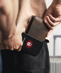 Two Pack RFID Blocking Cards For Wallet Protect Your Credit Debit And ID From NFC Skimming In Business Or Travel No Batteries Needed Durable Shield For Contactless Cards in use, shielding a wallet from scanning device.